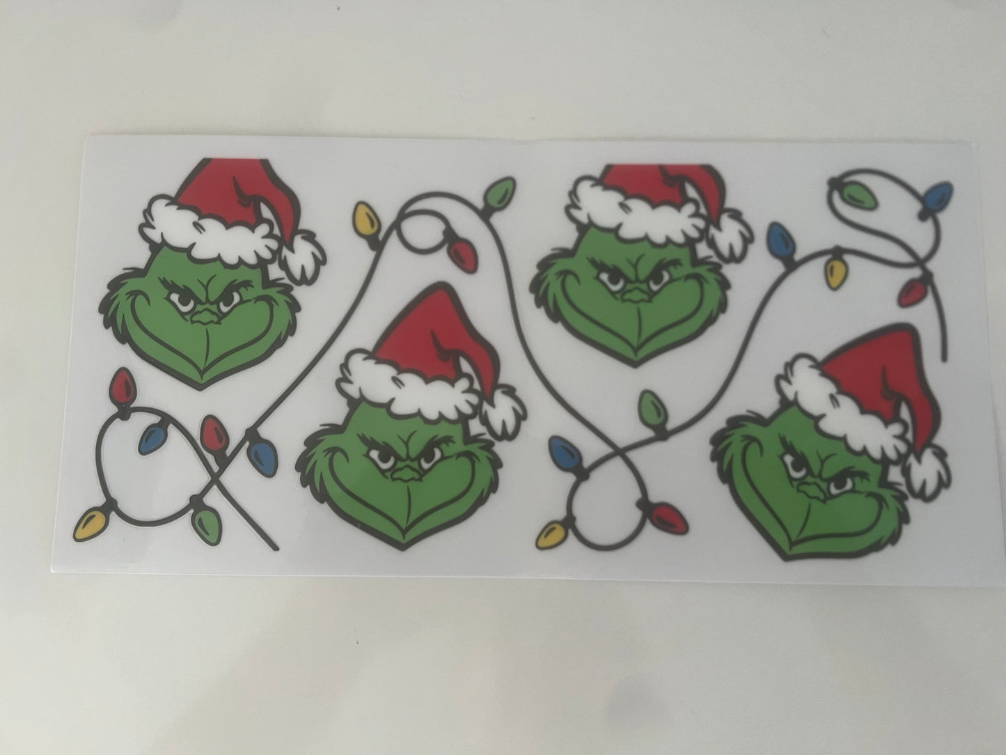 Grinch in Christmas lights wrap