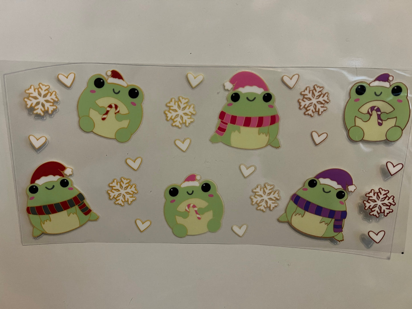 Cute frogs in hats and scarves wrap (UVPOD)